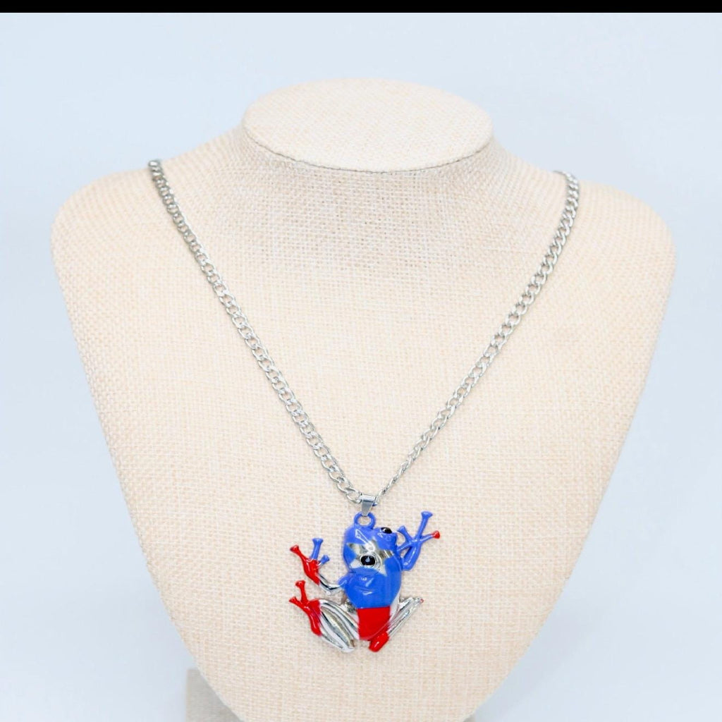 Necklace with a colorful pendant on a mannequin bust against a light blue background