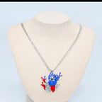Necklace with a colorful pendant on a mannequin bust against a light blue background