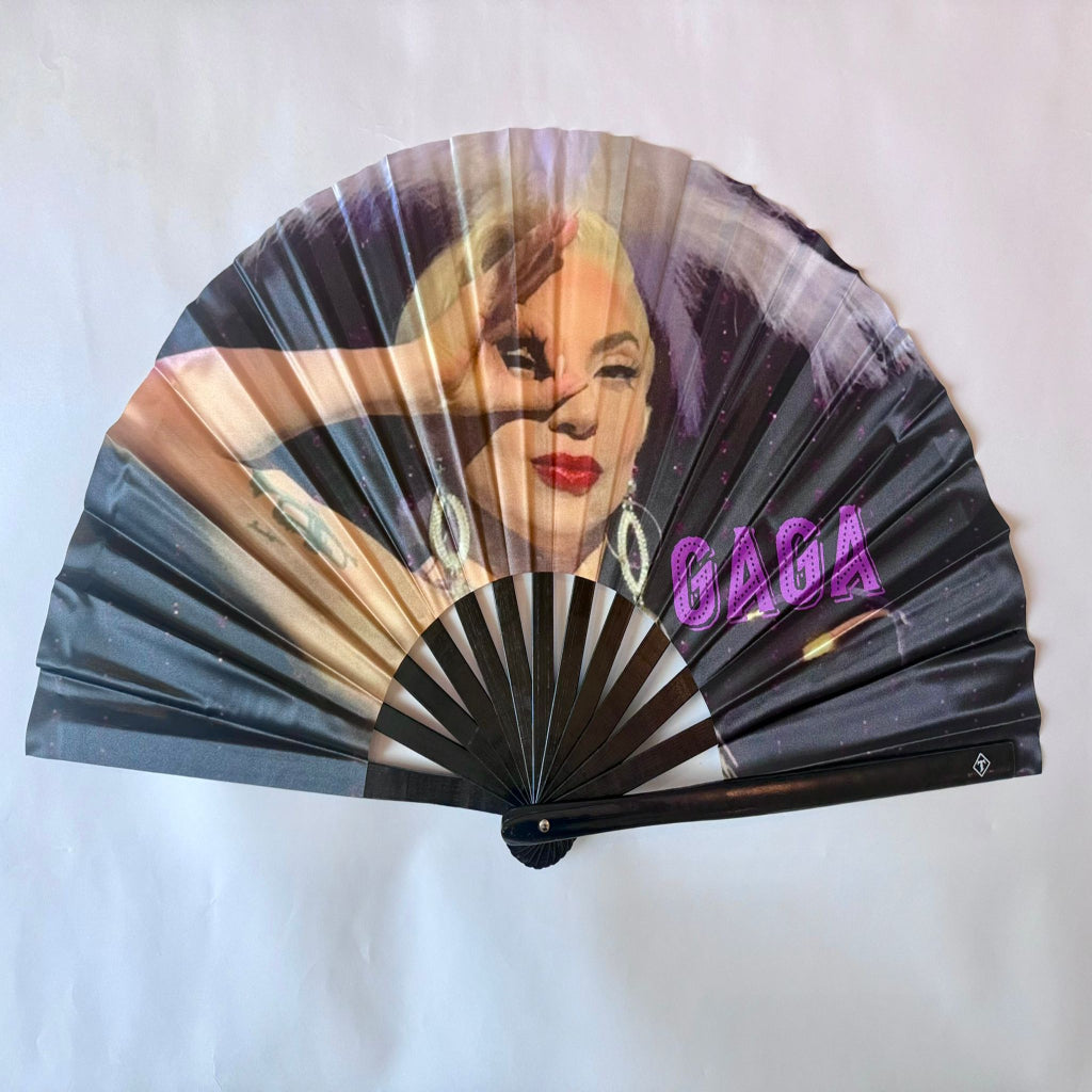 Handheld fan with a portrait of a famous person and the name 'Gaga' on a white background Main image