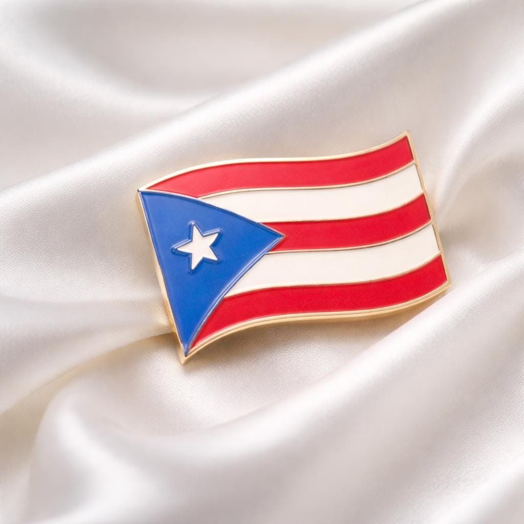 Flag pin with red, white, and blue colors on a satin background